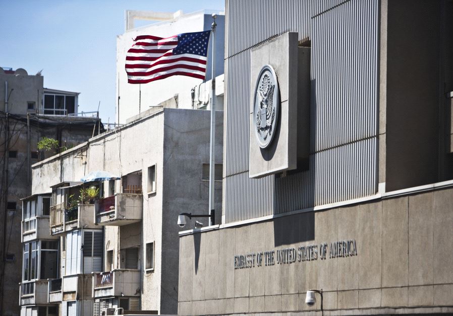 A flag flutters outside the US embassy in Tel Aviv August 4, 2013