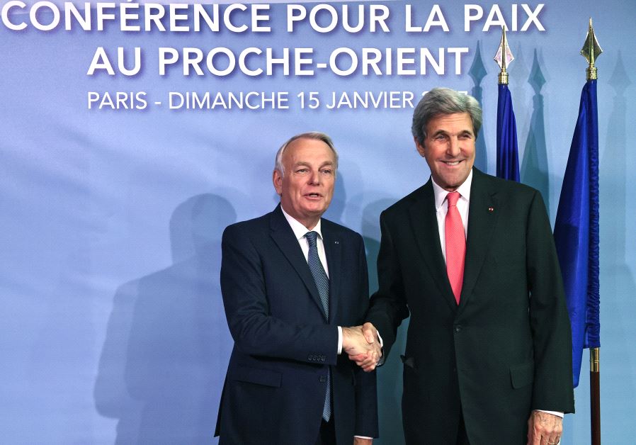 French Minister of Foreign Affairs Jean-Marc Ayrault welcomes US Secretary of State John Kerry as he arrives for the Mideast peace conference in Paris, France, January 15, 2017