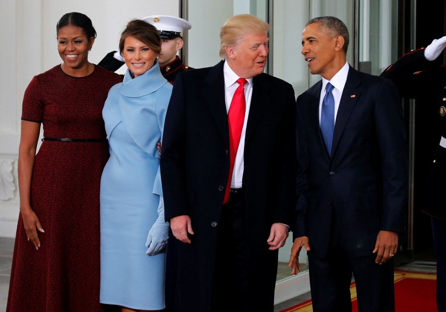 US President Barack Obama (R) and first lady Michelle Obama (L) greet US President-elect Donald Trump and his wife Melania for tea before the inauguration at the White House.