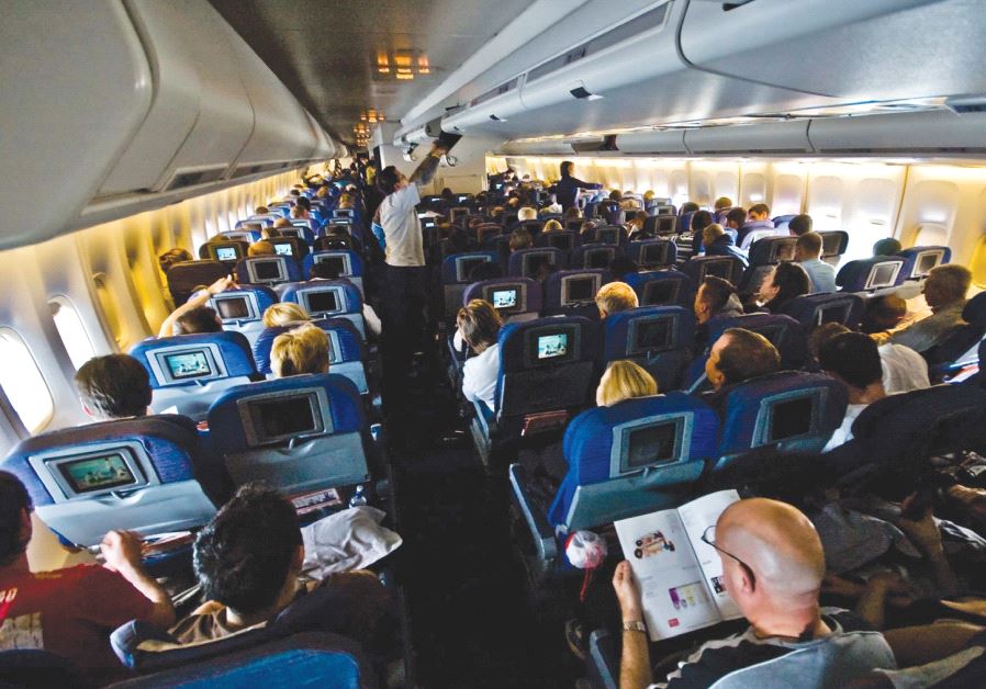Passengers sitting inside an airplane [illustrative]