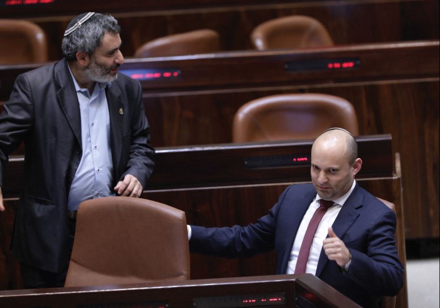 BAYIT YEHUDI MK Naftali Bennett gives the thumbs-up sign during the vote on the settlements regulation bill in the Knesset in Jerusalem Monday night.