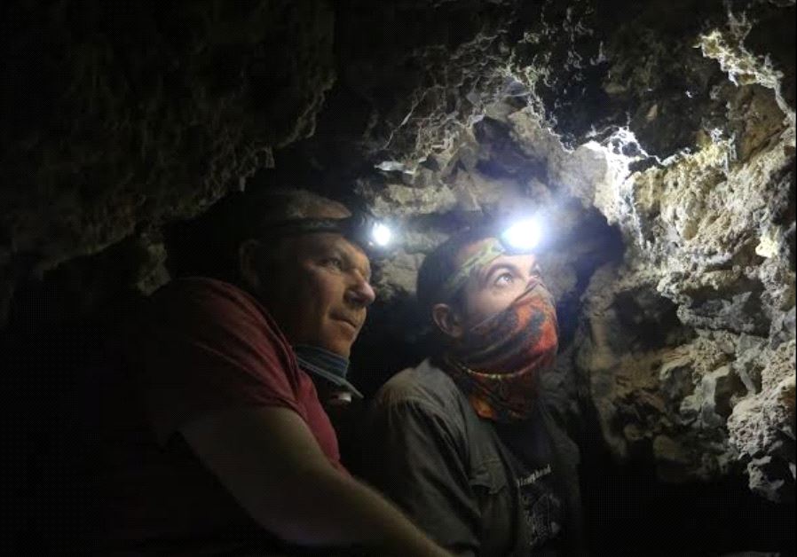 Archaeologists Oren Gutfeld and Ahiad Ovadia survey the cave