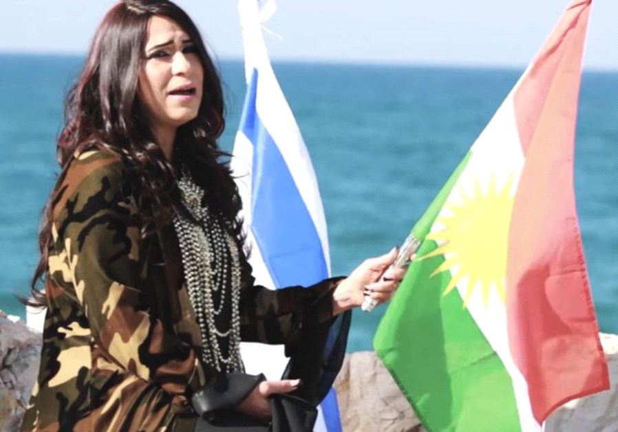 Hadassa Yeshurun holds Kurdish and Israeli flags in her music video