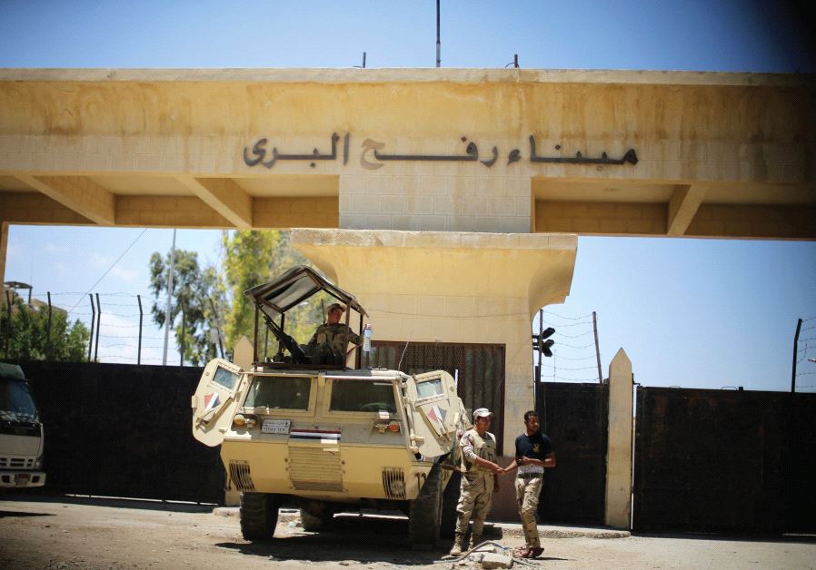 Egyptian soldiers stand guard in front of the Rafah border crossing between Egypt and the southern Gaza Strip