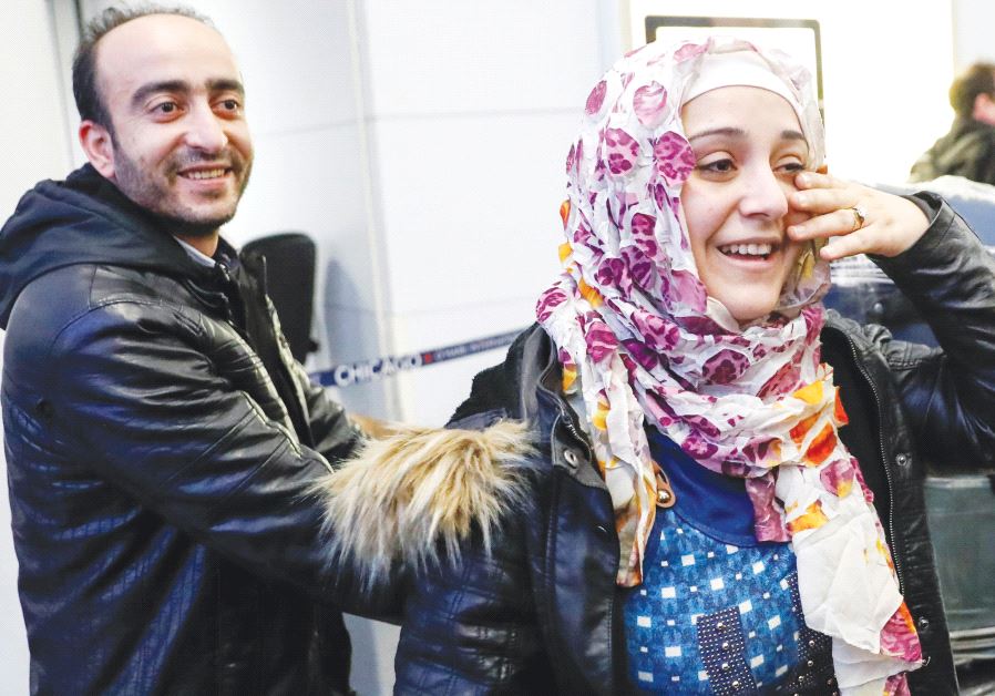 SYRIAN REFUGEES Baraa and her husband Abdulmajeed Haj Khalaf smile after arriving at O’Hare International Airport in Chicago, on Tuesday