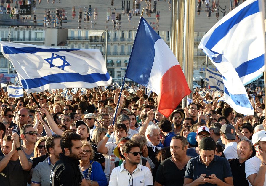 People hold Israeli and French flags as they take part in a demonstration supporting Israel on July 27, 2014 in Marseille, southeastern France