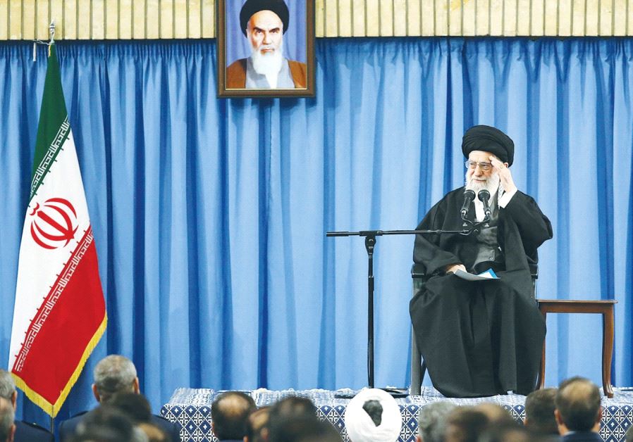 Iran's Supreme Leader Ayatollah Ali Khamenei waves as he delivers a speech in a meeting with military commanders in Tehran earlier this month