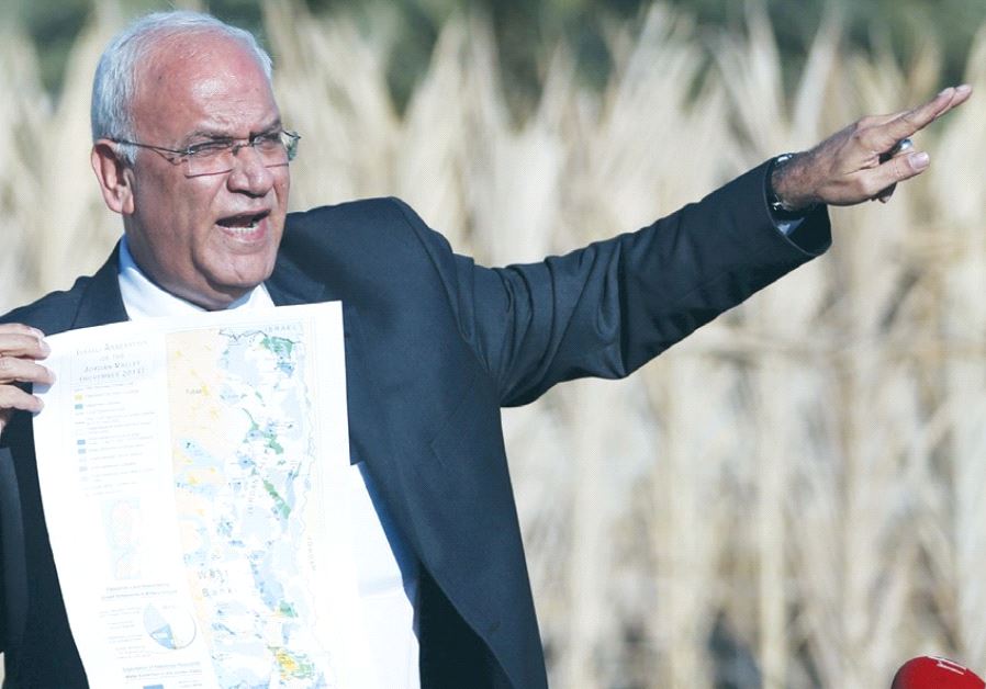 SENIOR PLO OFFICIAL Saeb Erekat speaks to reporters about Israeli appropriation of West Bank land, near Jericho last year.