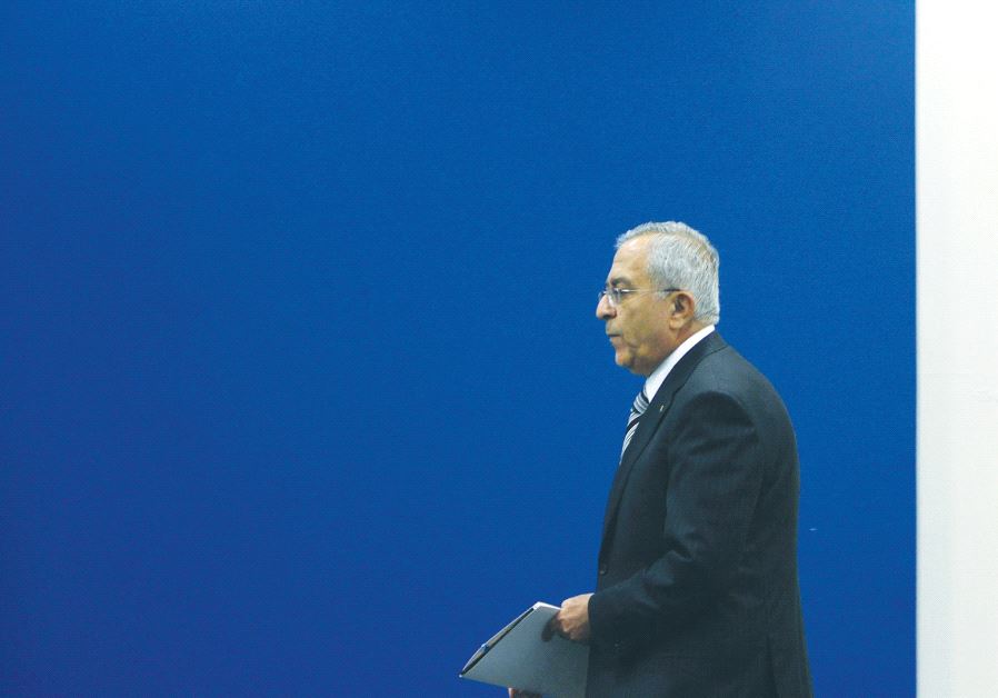 THEN-PALESTINIAN AUTHORITY Prime Minister Salam Fayyad arriving at a meeting in Ramallah in 2012.