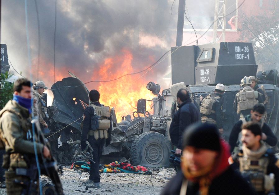 Iraqi Special Operations Forces (ISOF) are seen after a car bomb explodes during an operation to clear the al-Andalus district of Mosul of Islamic State militants, January 17