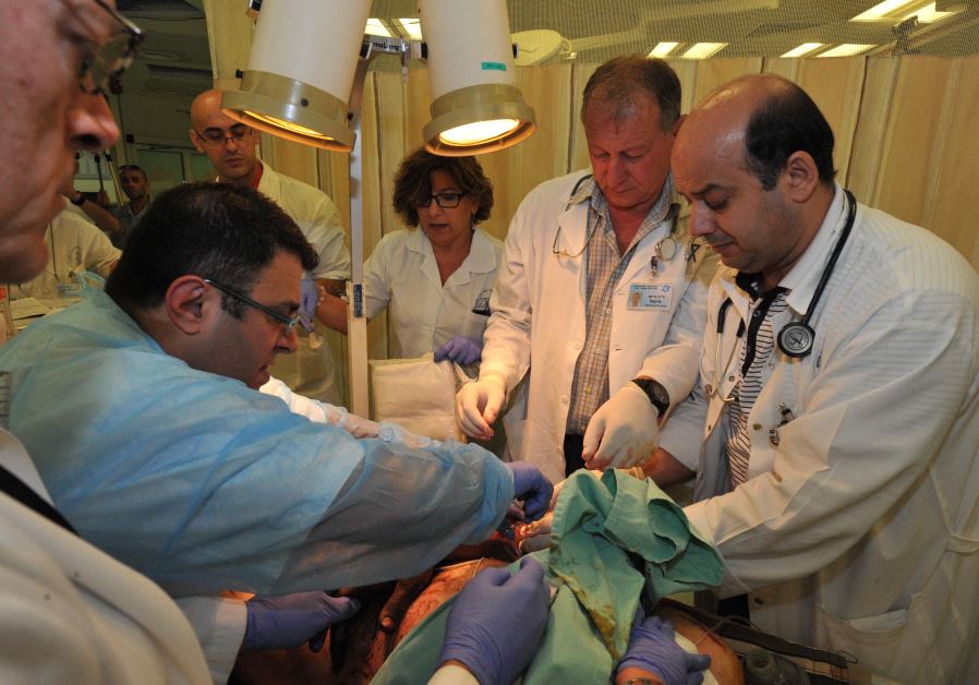 Doctors at the Western Galilee Medical Center treat wounded Syrians.