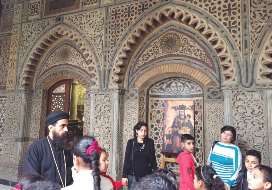 Coptic Christians crowd into a church in Cairo. Copts in the Sinai have recently come under attack by Islamic State