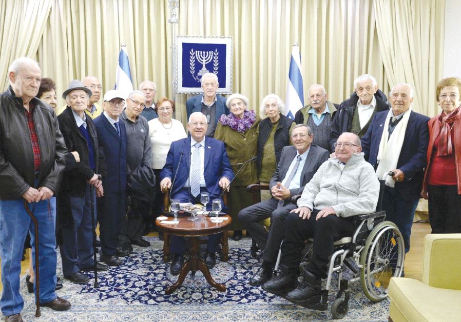 PRESIDENT REUVEN RIVLIN sits in the center of former Lehi members and others marking 75 years since the death of the group’s founder Avraham Stern