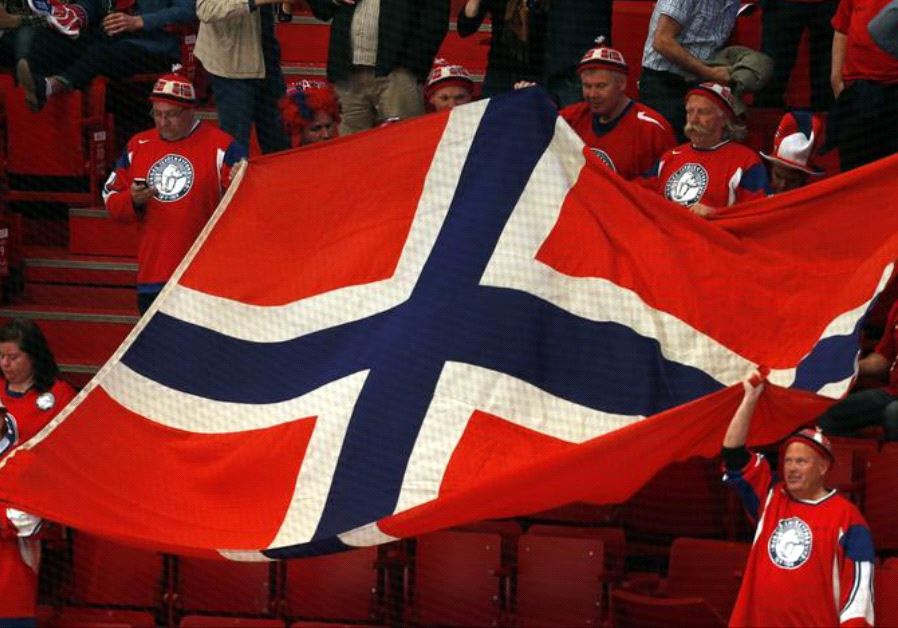 Norway's fans hold up a flag in support of their team 