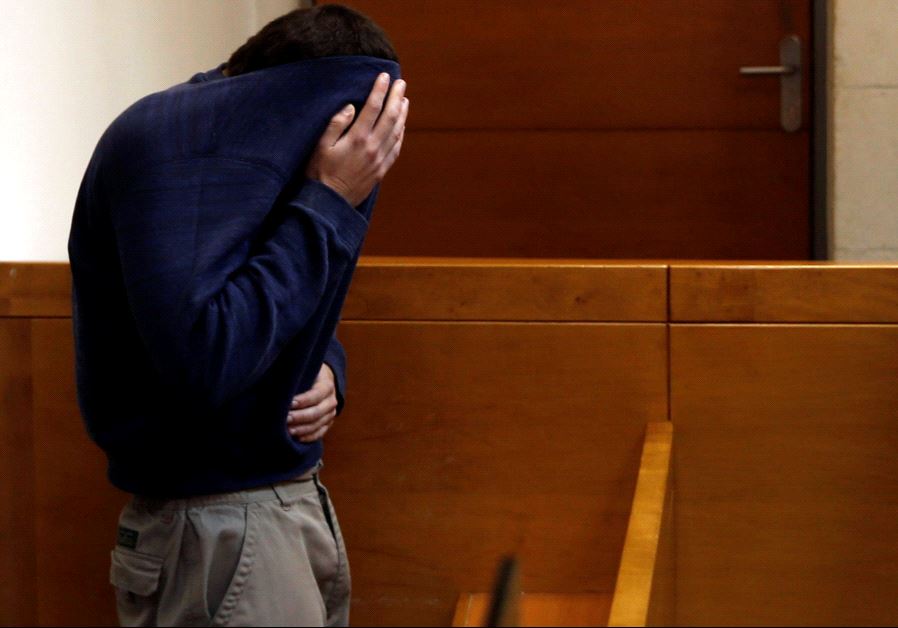An US-Israeli teen who was arrested in Israel on suspicion of making bomb threats against Jewish community centers in the United States, Australia and New Zealand over the past three month, is seen before the start of a remand hearing at Magistrate's Court in Rishon Lezion, Israel March 23, 2017.