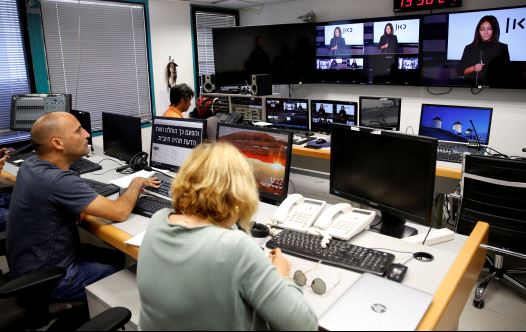 FILE PHOTO: Employees work in the offices of Kan, the new Israeli Public Broadcasting Corporation, in Tel Aviv, Israel November 3, 2016.