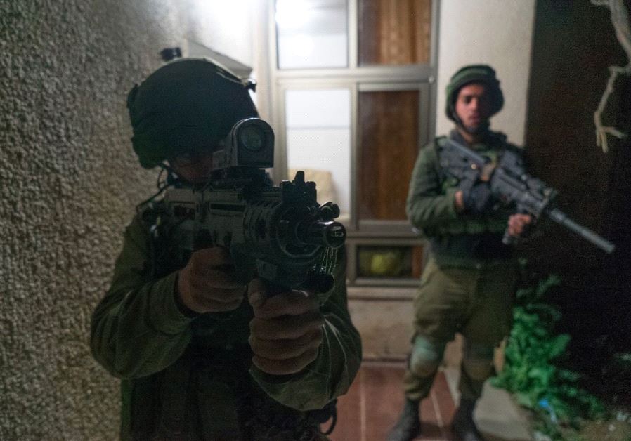Israeli forces raid village of terrorist who killed IDF soldier 