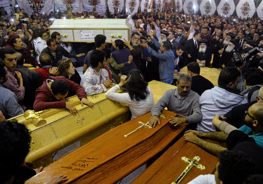 Relatives of victims react to coffins arriving to the Coptic church that was bombed on Sunday in Tanta, Egypt, April 9, 2017