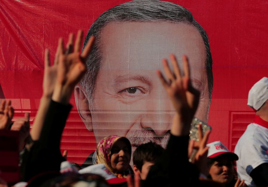 Supporters listen to the speech by Turkish President Tayyip Erdogan during a rally for the upcoming referendum in Istanbul, Turkey