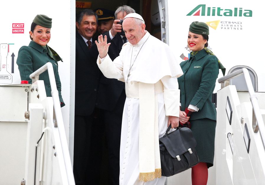 Pope Francis waves as he leaves for his pastoral trip to Egypt at the Leonardo da Vinci-Fiumicino Airport in Rome, Italy, April 28, 2017