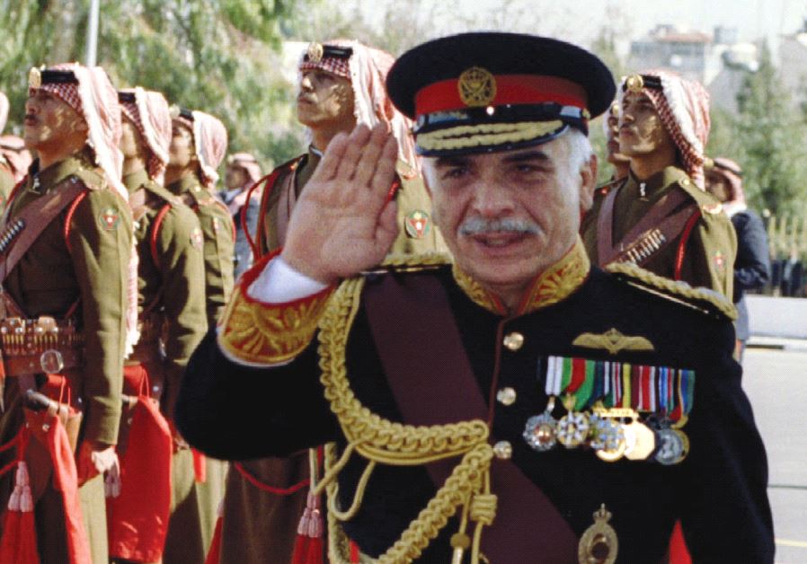Jordan's King Hussein reviews Beduin guards of honor in 1992