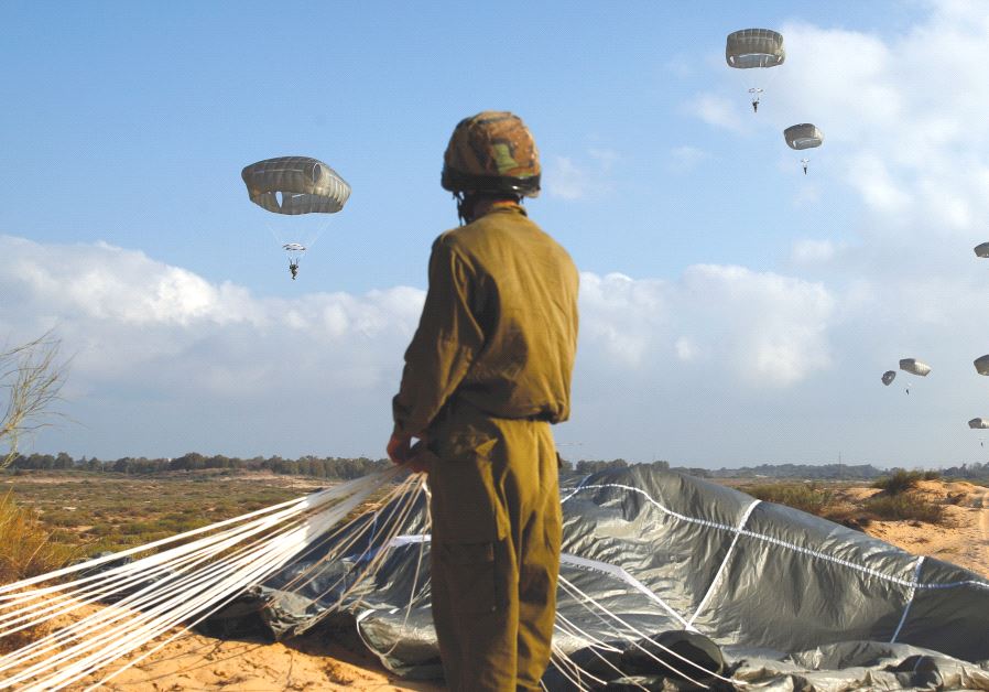 An Israeli paratrooper takes part in a military exercise at the Palmahim air force base