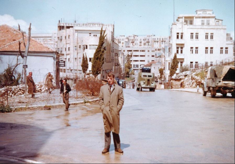 Robert F. (Bobby) Kennedy standing on Julian’s Way, Jerusalem, known today as King David Street, April 1948. Barbed wire and a British Army checkpost can be seen in the background