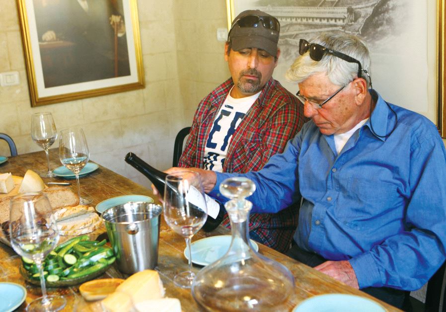 Dr. Yair (right) and Assaf Margalit inspecting their newly launched wine
