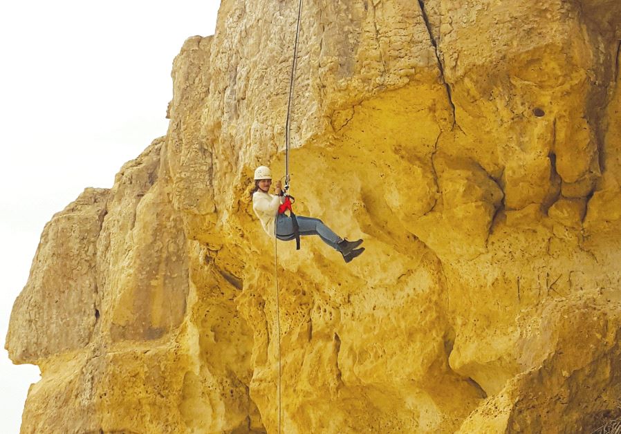 A leap of faith at the rappelling station at the Mitzpe Ramon Visitor Center