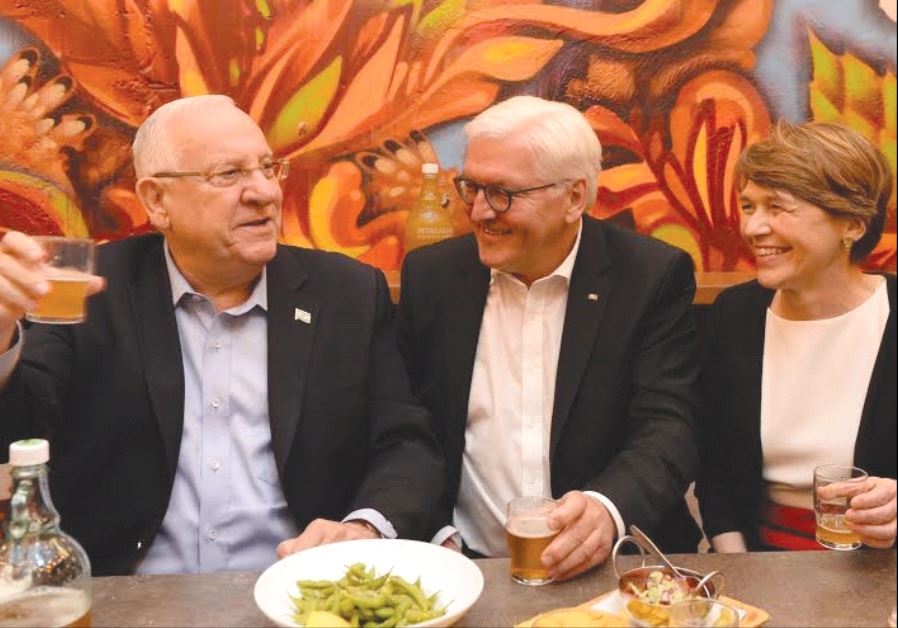 PRESIDENTS REUVEN Rivlin and Frank-Walter Steinmeier, together with Steinmeier’s wife, Elke Budenbender, sample Israeli beer in the informal atmosphere of the Beer Bazaar at the Mahaneh Yehuda market.