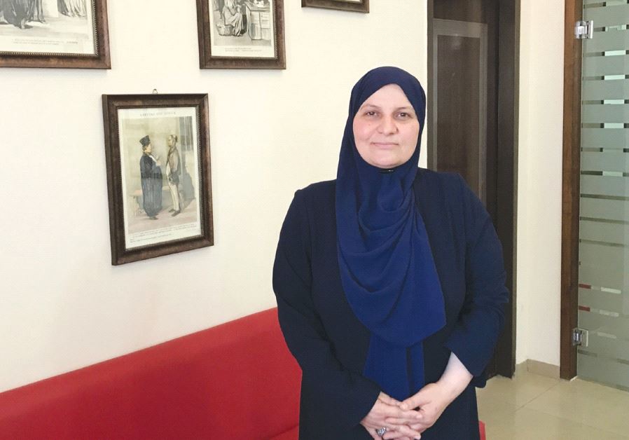 Islamic jurist Hana Mansour-Khatib poses in her office in Tamra, in the eastern Galilee.