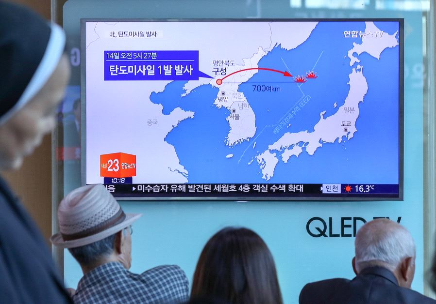 People watch a news report on North Korea firing a ballistic missile, at a railway station in Seoul, South Korea, May 14, 2017