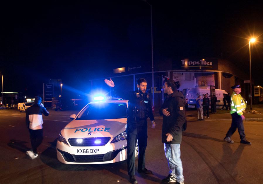 Police set up a cordon outside the Manchester Arena in northern England where U.S. singer Ariana Grande had been performing in Manchester, Britain