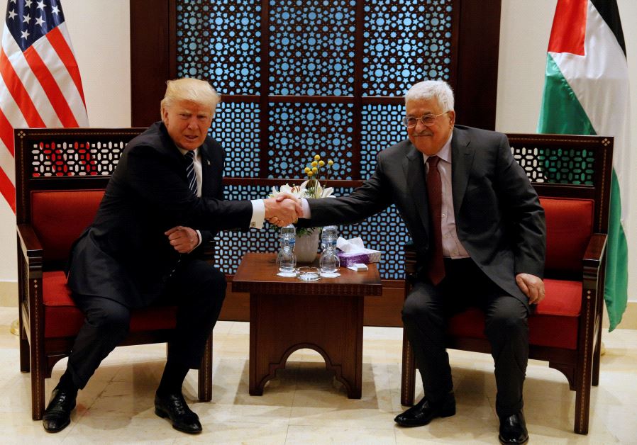 US President Donald Trump shakes hands with Palestinian Authority President Mahmoud Abbas during their meeting at the presidential headquarters in the West Bank town of Bethlehem, May 23, 2017