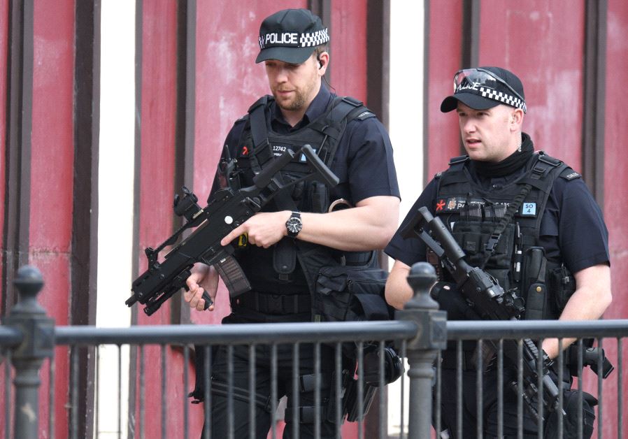 Armed police patrol near Manchester Arena following a deadly terror attack in Manchester, northwest England on May 23, 2017