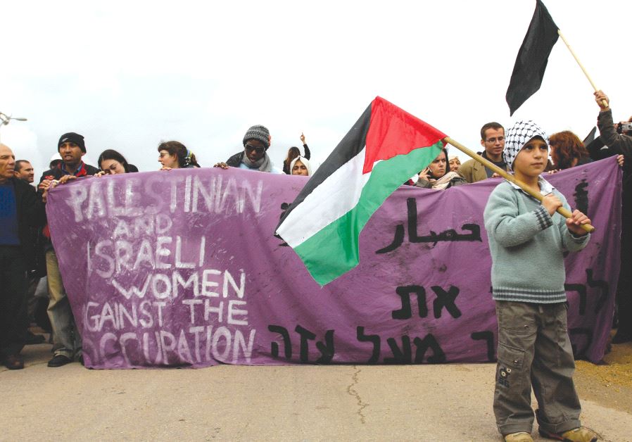 PRO-PALESTINIAN ACTIVISTS protest near the Erez Crossing in 2008.