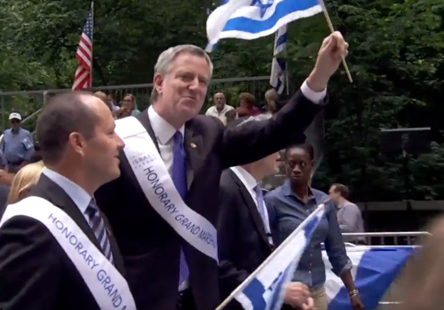 New York Mayor Bill De Blasio marches alongside Jerusalem Mayor Nir Barkat at the Celebrate Israel Parade in New York City
