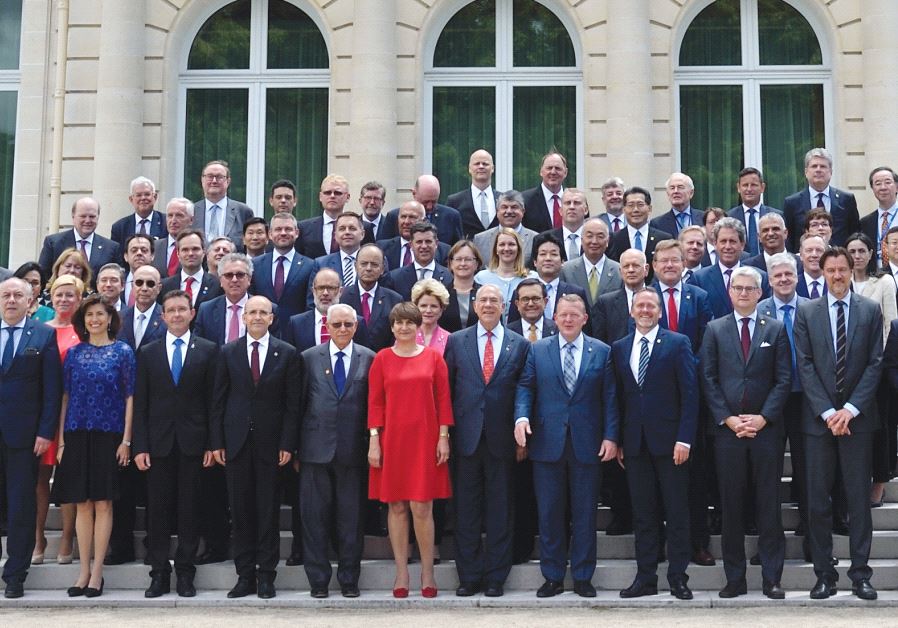FINANCE MINISTER Moshe Kahlon and his counterparts smile at the OECD Ministerial Council meeting in Paris yesterday