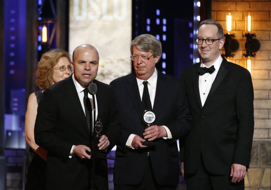 J.T. Rogers (L) accepts Best Play for "Oslo" at the 71st Tony Awards, June 11 2017.