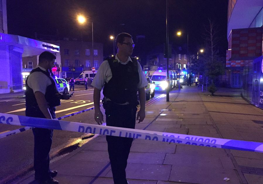 Police are seen near Finsbury Park as British police say there are casualties after reports of vehicle colliding with pedestrians in North London, Britain June 19, 2017