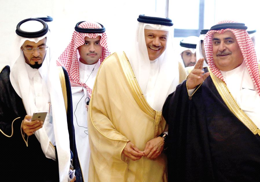 Secretary-General of the Gulf Cooperation Council Abdullatif bin Rashid Al Zayani and Bahrain’s Foreign Minister Khalid bin Ahmed Al Khalifa walk during a meeting of foreign ministers of GCC member states, in Riyadh, Saudi Arabia, in March