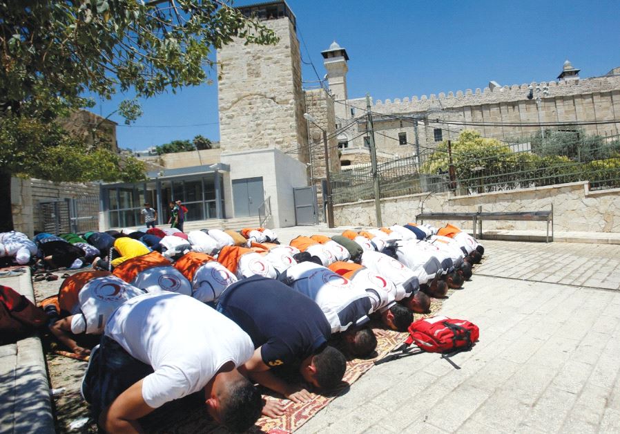 Muslims attend Friday prayers at the Tomb of the Patriarchs in Hebron, holy to both faiths as the burial site of Abraham