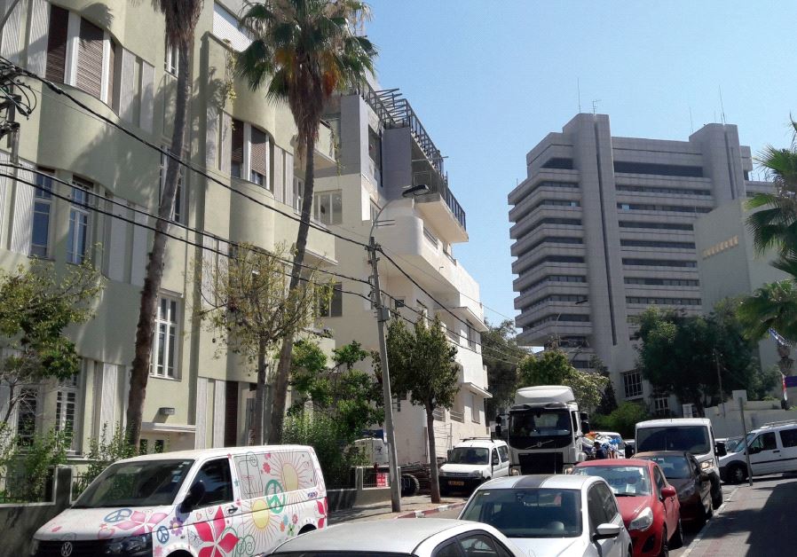 The Israel Electric Corporation office block overlooks a delicately restored and renovated eclectic-style residential building