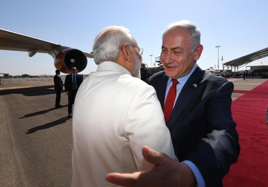 Prime Minister Benjamin Netanyahu embraces visiting Indian Prime Minister Narendra Modi upon his arrival in Israel, July 4, 2017