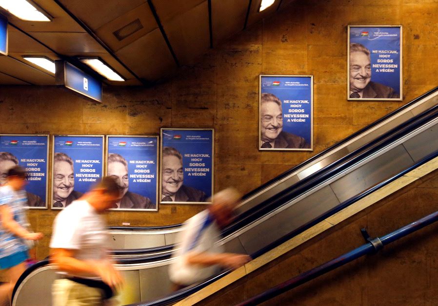 Hungarian government poster portraying financier George Soros and saying "Don't let George Soros have the last laugh" is seen at an underground stop in Budapest, Hungary July 11, 2017. 