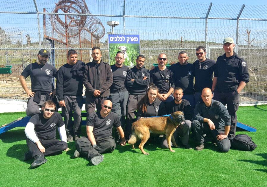 Prison service employees at the inauguration of the security dogs retirement home in Damon Prison on July 4, 2017.