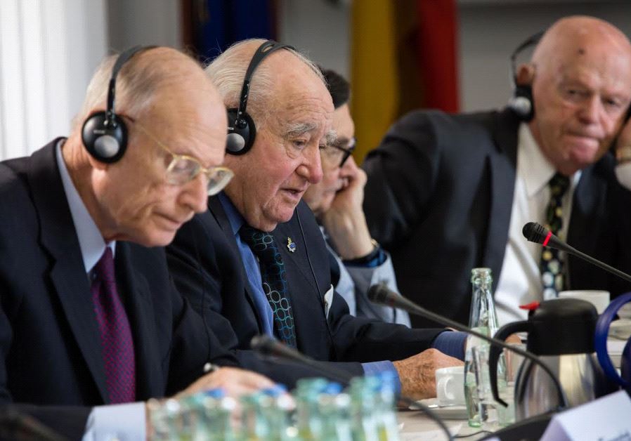 Ambassador Eizenstat is the closest to camera Next to him are Auschwitz survivor, Roman Kent and Marian Turski last is Ben Helfgott, survivor of Buchenwald