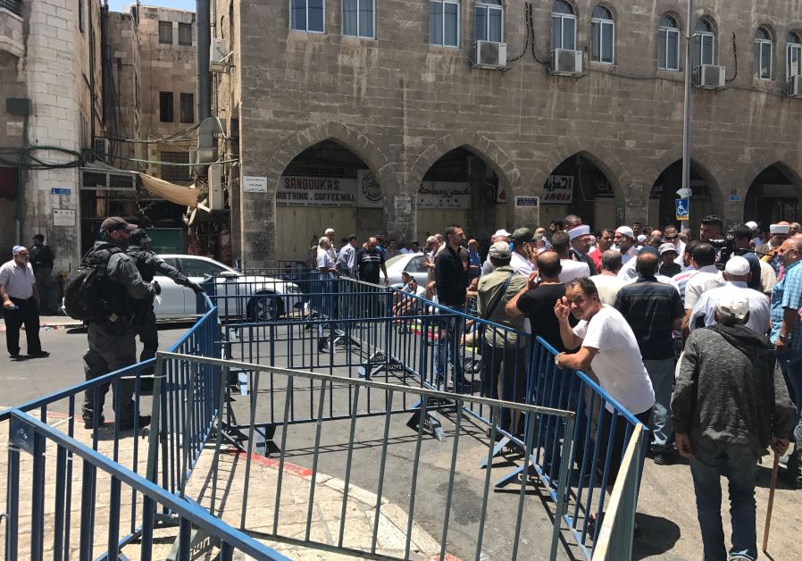 Israeli police man a barricade on Salah a Din street after a deadly terror attack in Jerusalem, July 14, 2017.