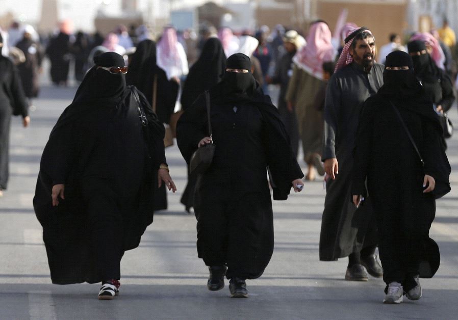 Women wearing traditional Saudi clothing, or an abaya