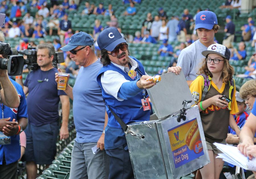 Sep 17, 2016; Chicago, IL, USA; Television personality Stephen Colbert is dressed as a hot dog vendor prior to a game between the Chicago Cubs and the Milwaukee Brewers at Wrigley Field